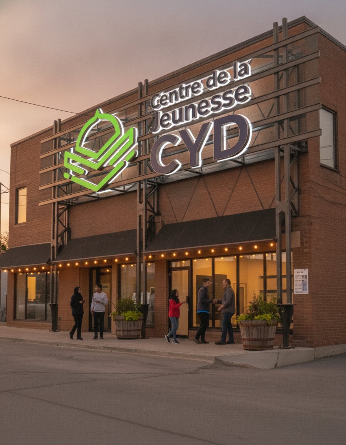 The CYD Center at dusk, families and youth gathering at the entrance